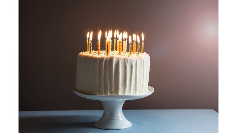 Still life of birthday cake with candles.