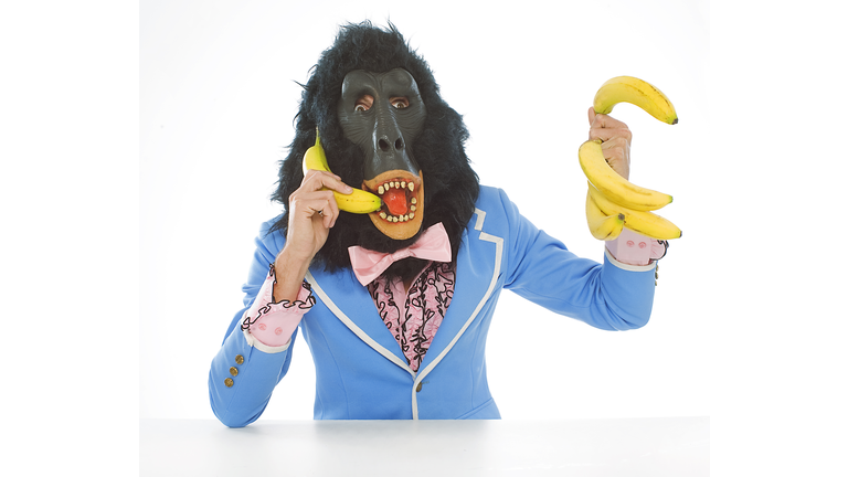 Man in Gorilla Mask Talking on Banana Phone