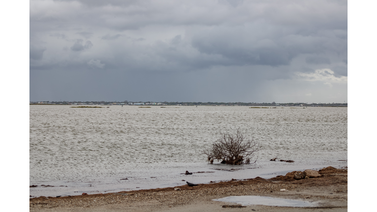 A visible rain squall from Tropical Storm Nicholas passes over the Flour BLuff area of Corpus Christi, Texas on September 13, 2021.