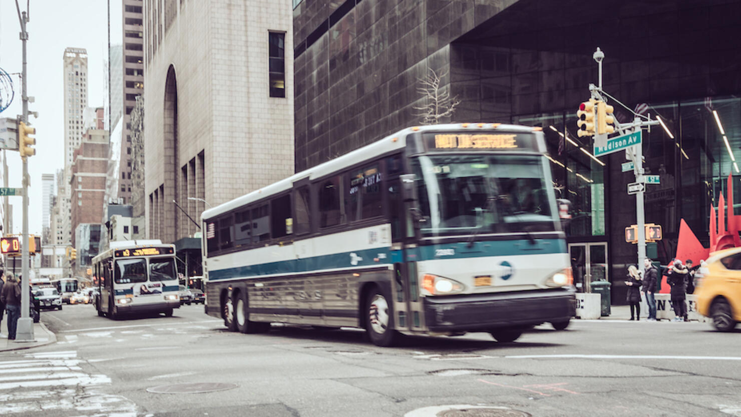 Public transportation buses on Fifth Avenue , Midtown Manhattan