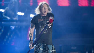 Woman claims Axl Rose hit her in the face with a microphone stand