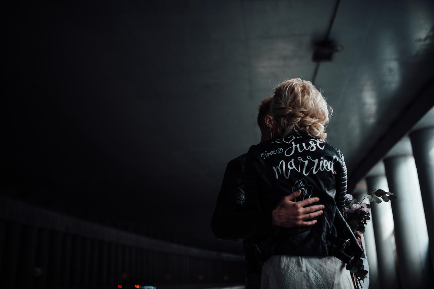 Rear View Of Woman Standing Against Wall