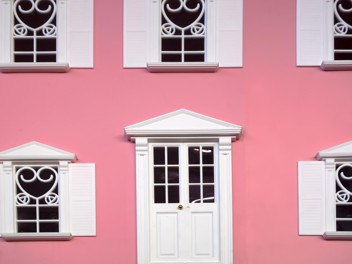 Facade of pink miniature dollhouse