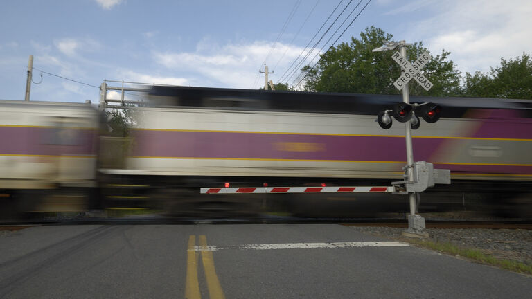 Speeding train crossing a street