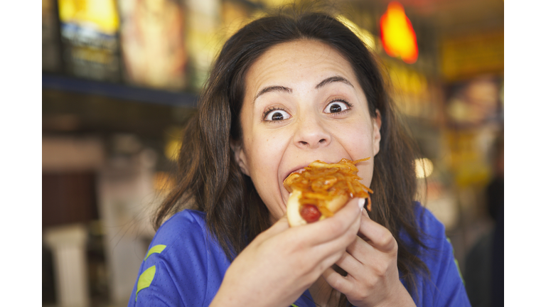 Woman Eating a Hot Dog