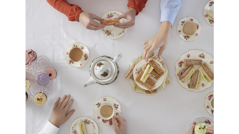 Overhead view of people having tea