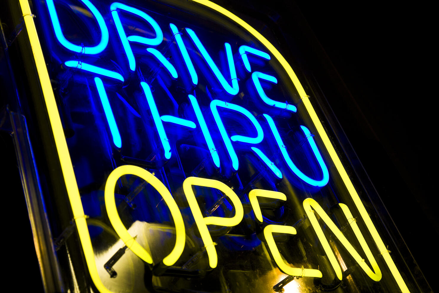 neon drive thru sign blue and yellow