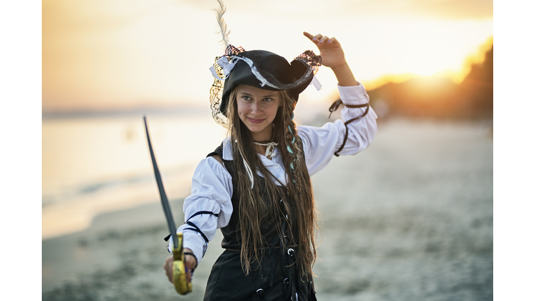 Cute pirate girl holding a sabre