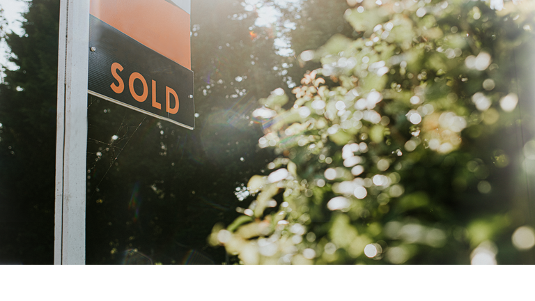 'SOLD' real estate sign outside a Property