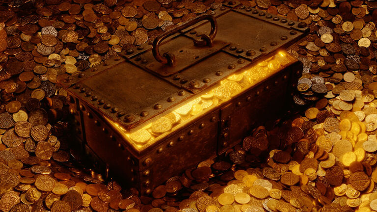 TREASURE CHEST SURROUNDED BY AND FULL OF COINS