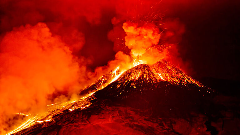Scenic View Of Lava Erupting From Volcano