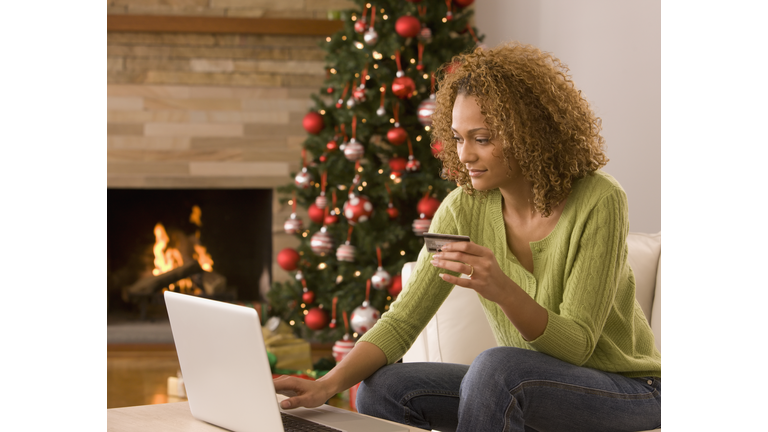 Mixed race woman shopping online