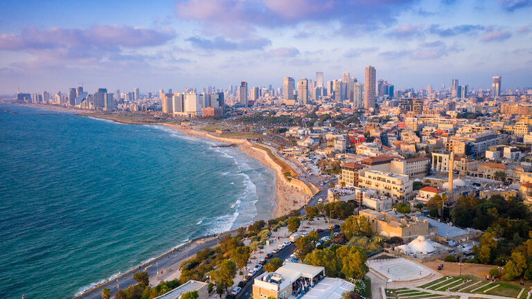 High Angle View Of Buildings By Sea Against Sky