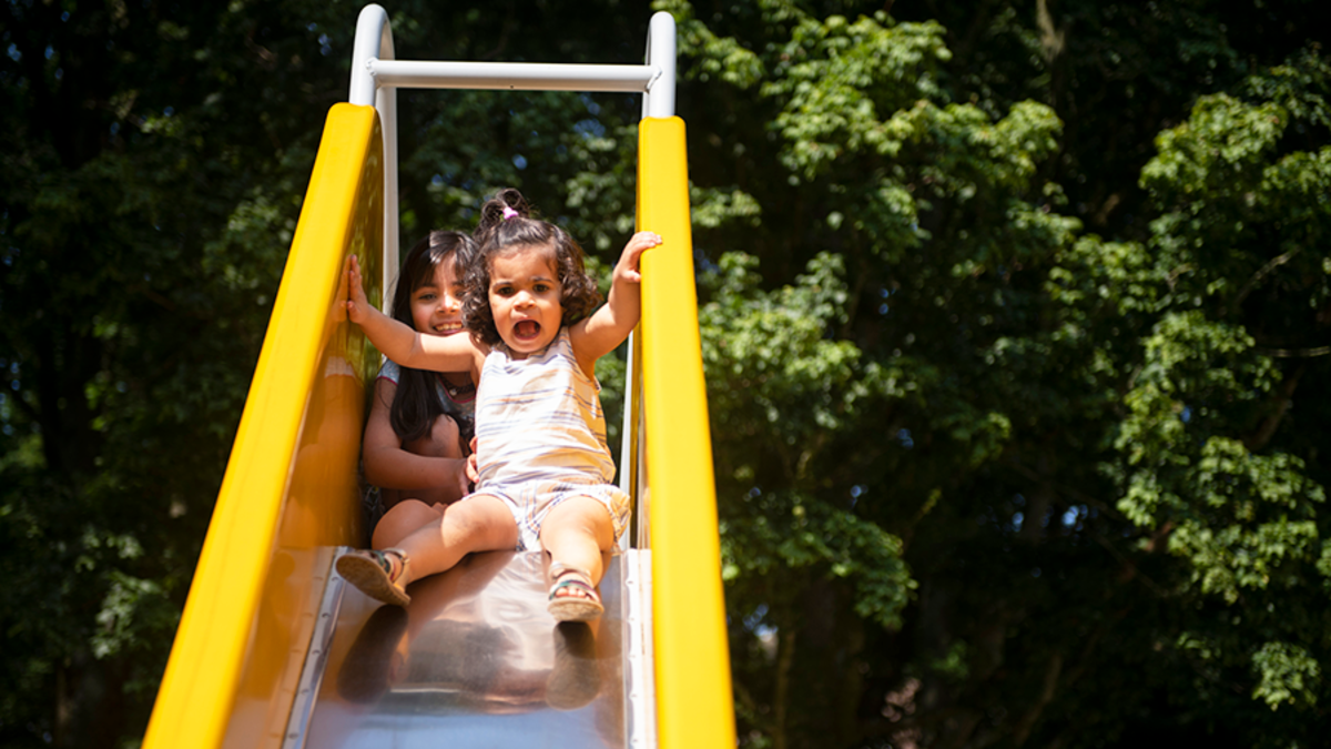 Here's Why It's Dangerous To Go Down a Slide With Your Child