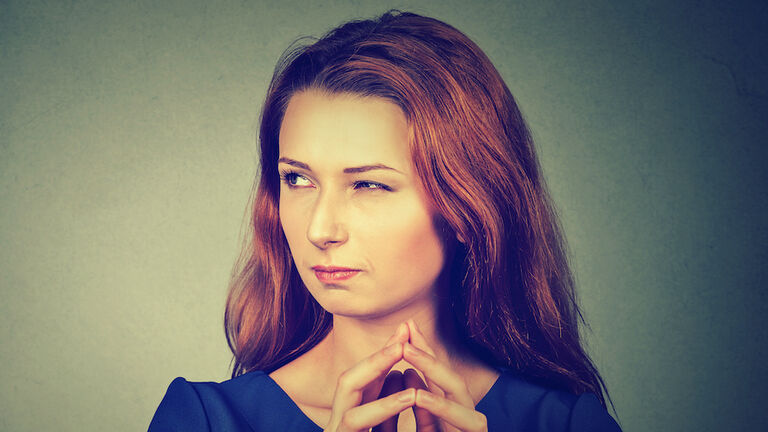 sneaky, sly, scheming young woman plotting something