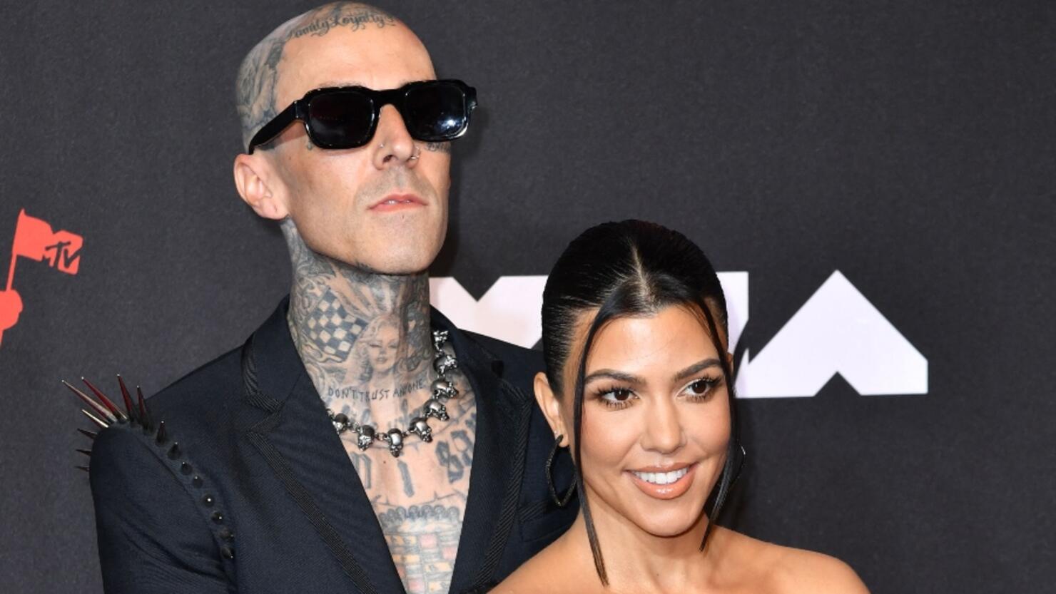 Travis Barker Gets Handsy With Kourtney Kardashian's Feet In Holiday ...