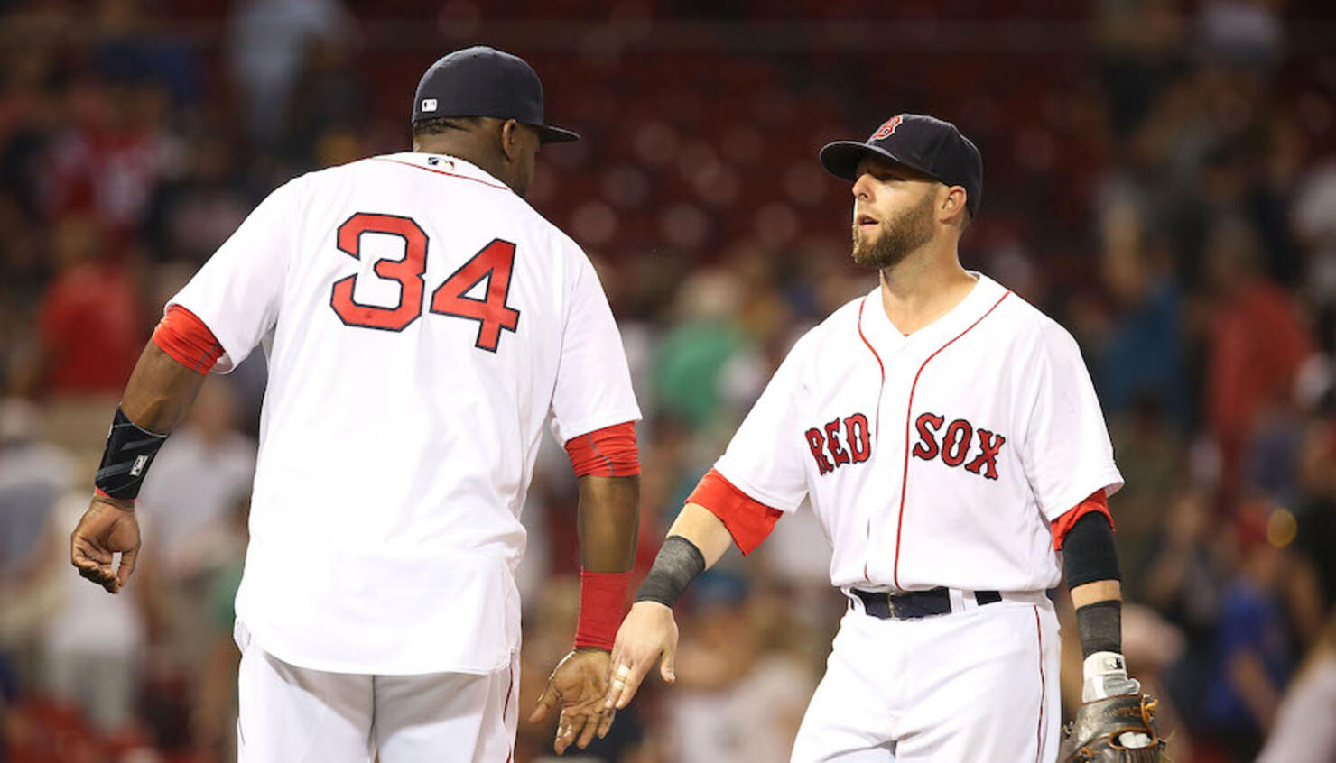 Boston Red Sox's Manny Ramirez hugs teammate David Ortiz (34