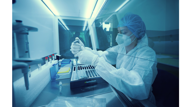 Young Scientist Working in The Laboratory test SARS-COV-2 pcr diagnostics kit.