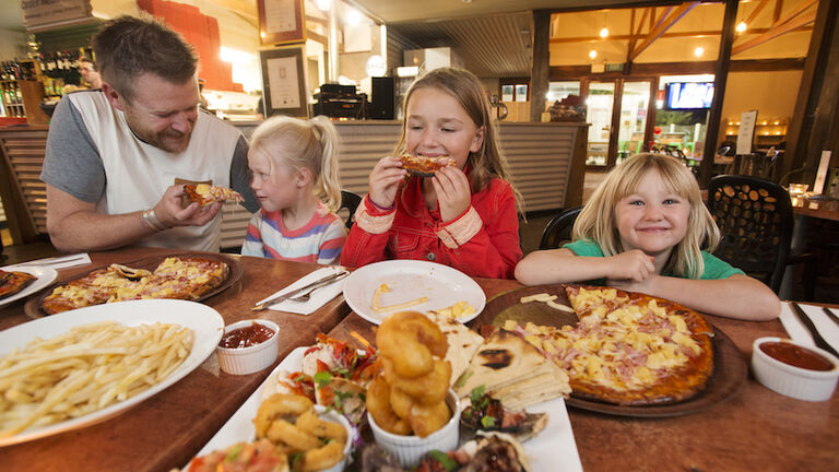 Family eating seafood at restaurant