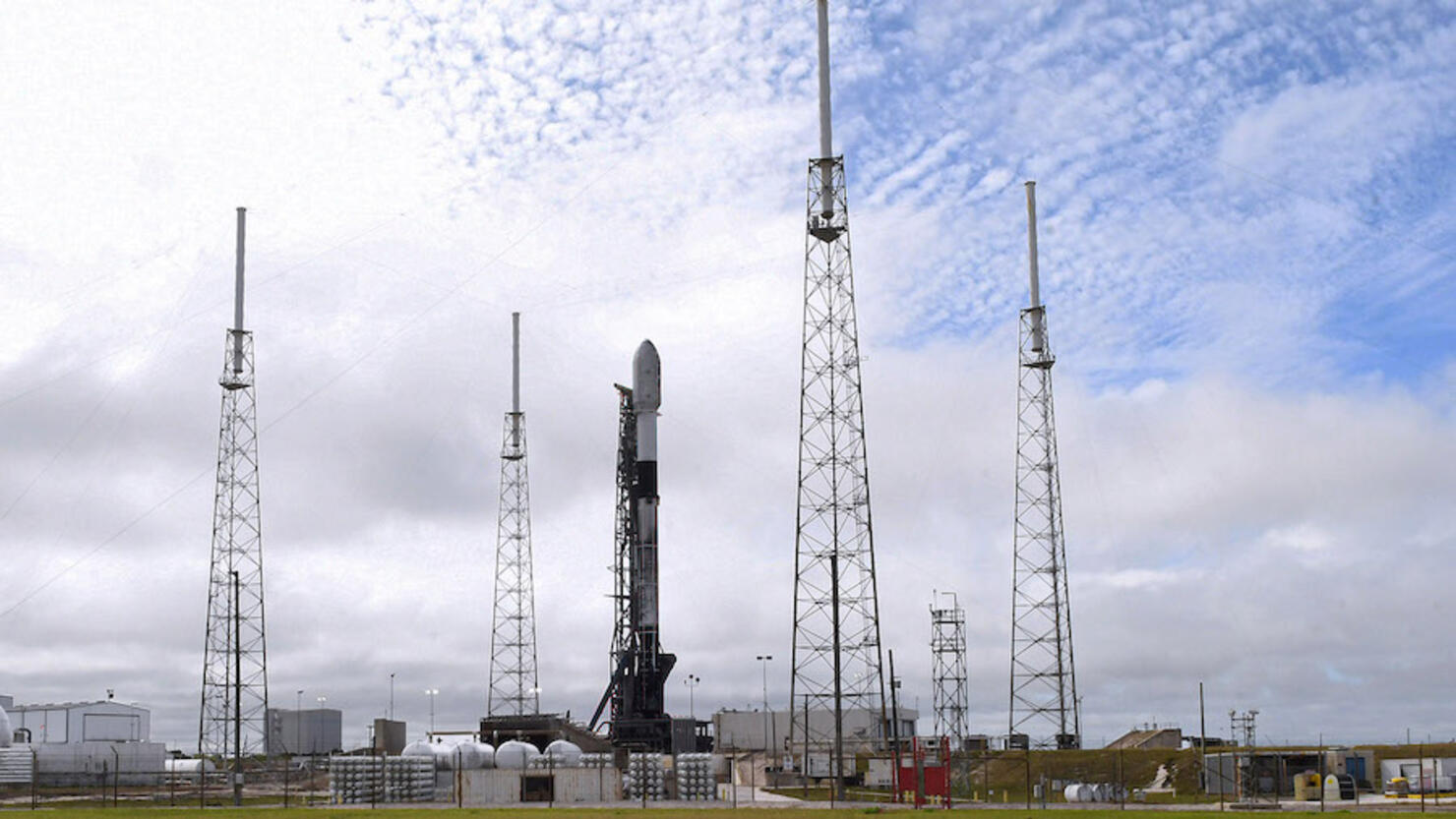 A SpaceX Falcon 9 rocket stands ready for launch at pad 40