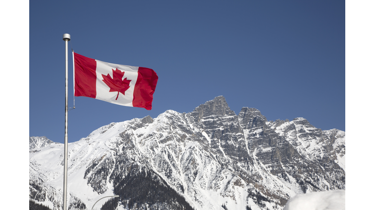 Canada flag in mountains