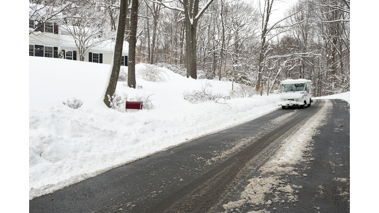 Mail Truck delivering letters in the snow