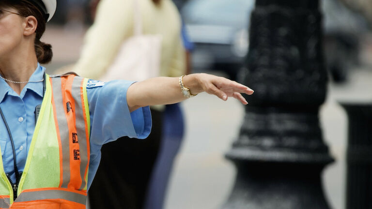 Close-up of a crossing guard directing traffic, Chicago, Illinois, USA