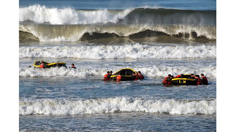 US Navy SEAL recruits participate in a surf passage training exercise