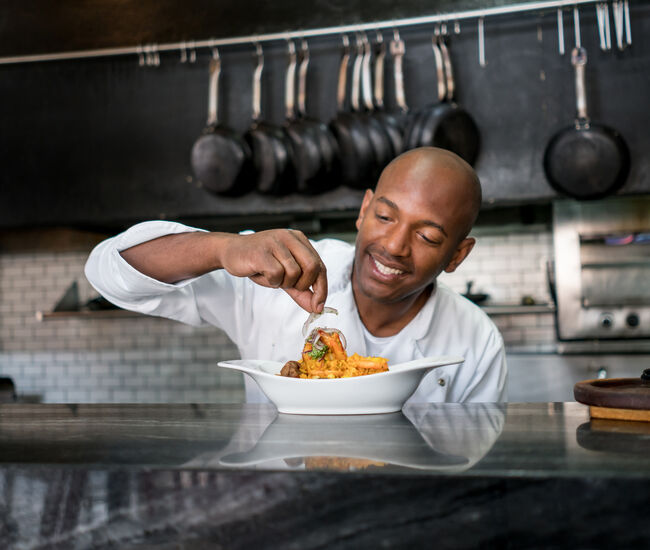 Chef decorating a plate