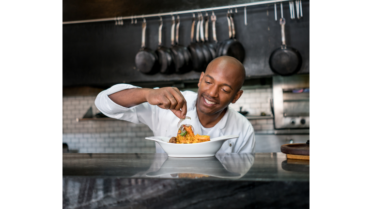 Chef decorating a plate