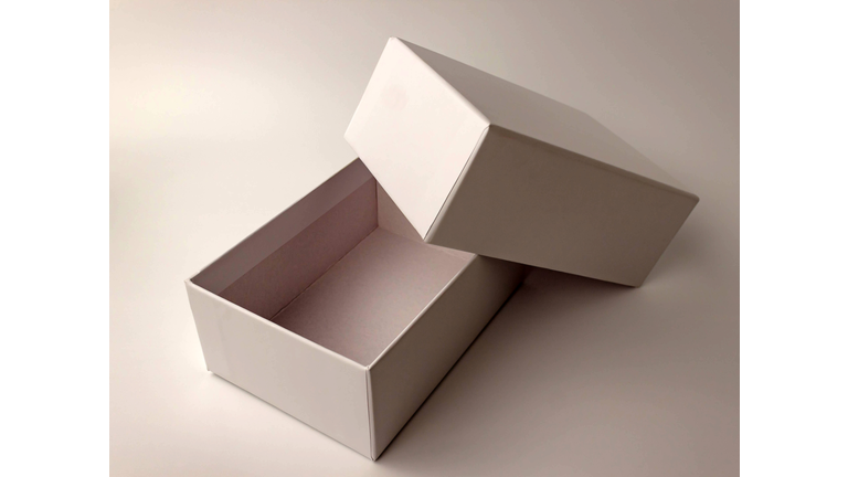 Single white paper box on light background. Packing, transportation, moving, present concept