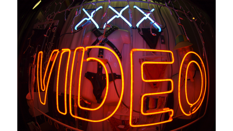 Triple X-Rated Video Bulge Neon Sign at Night