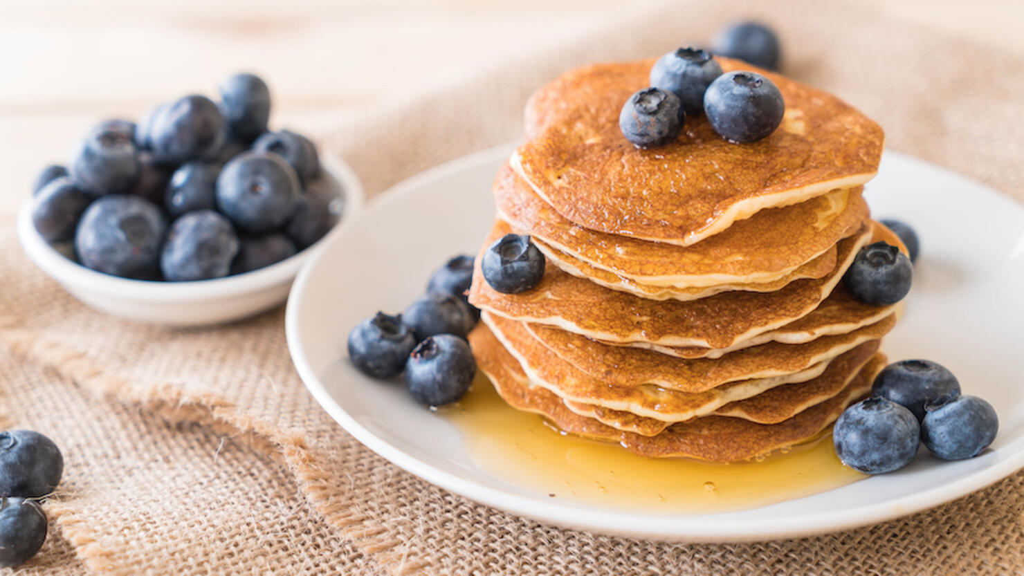 Close-up of pancakes in plate on table