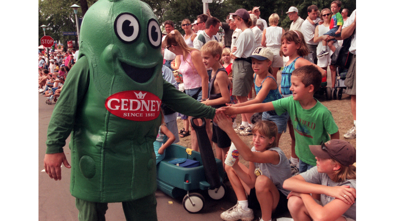 GENERAL INFORMATION: Dan Haugan is the Gedney Pickles mascot and marches in the daily State Fair parade.

IN THIS PHOTO: Falcon Heights, Mn., Thurs., Aug. 31, 2000--(Left to right) Dan Haugan, the Gedney Pickles mascot, greets young fans along the daily S