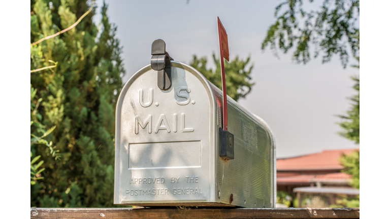 US mailbox from the front with upright flag