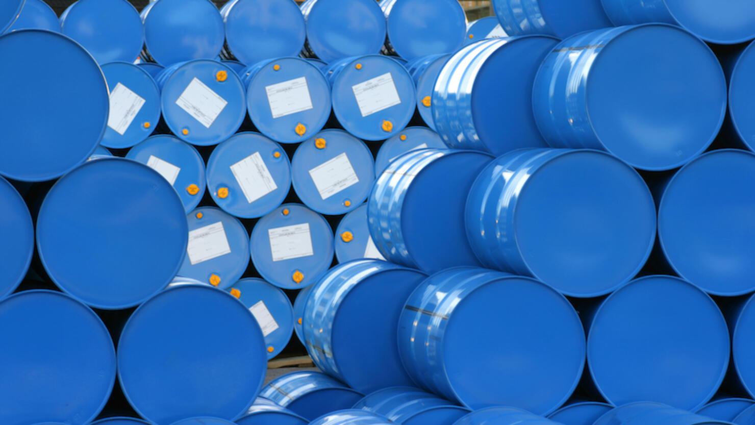 A warehouse full of blue Hugh barrels 