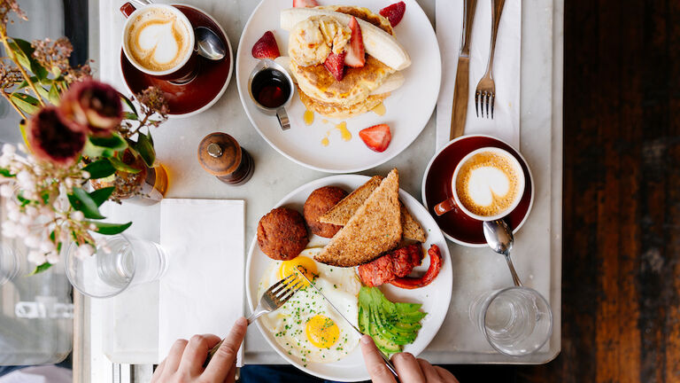 Man eating brunch at the restaurant, directly above view