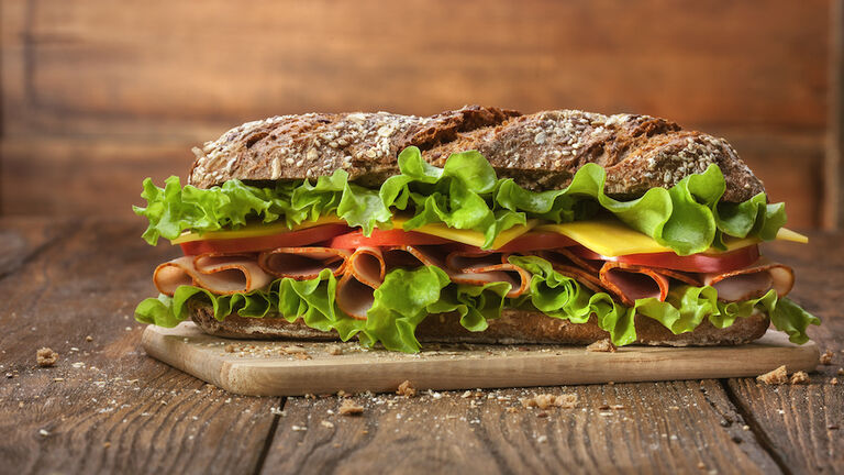 Sandwich On The Wooden Table