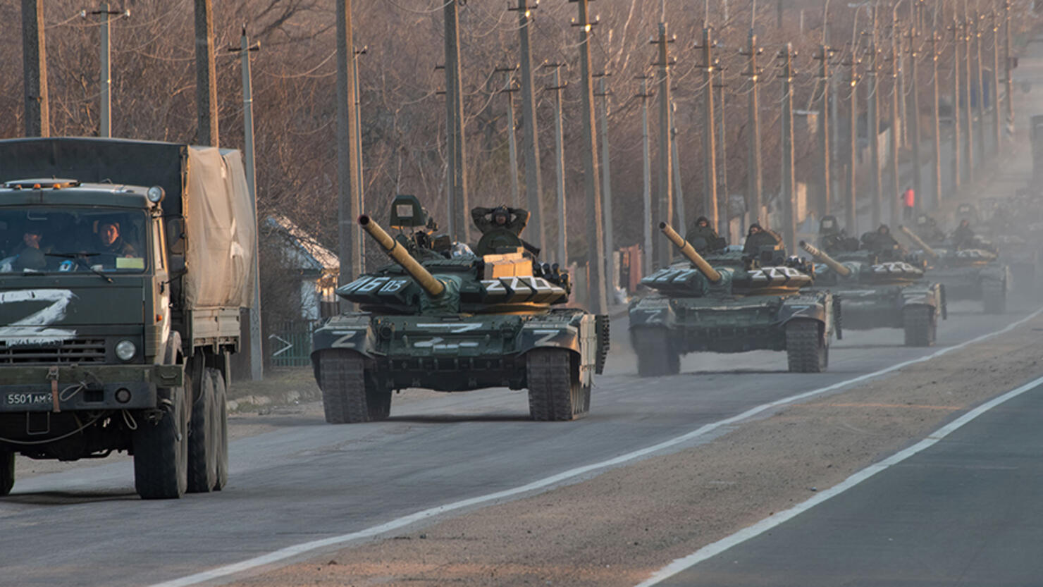 A column of tanks marked with the Z symbol stretches into