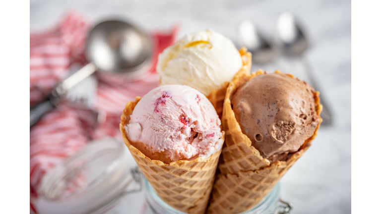 strawberry, vanilla, chocolate ice cream with waffle cone on marble stone backgrounds