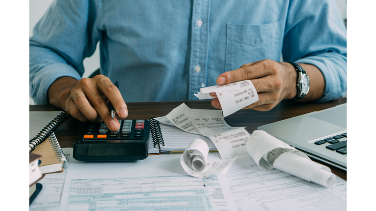 Midsection Of Accountant Working On Table