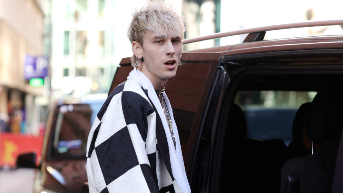 Machine Gun Kelly pulls off messy platinum locks and showcases unique sense  of style at JFK airport