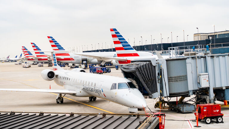 American Airlines planes finishing up for take-off at gate