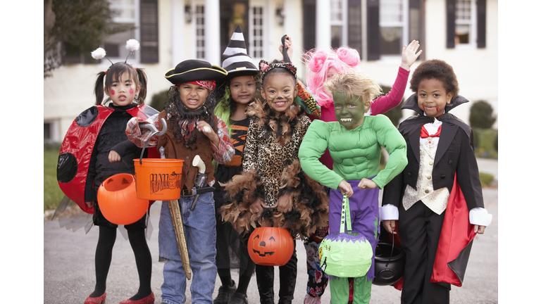 Children (4-7) dressed up for Halloween, group portrait