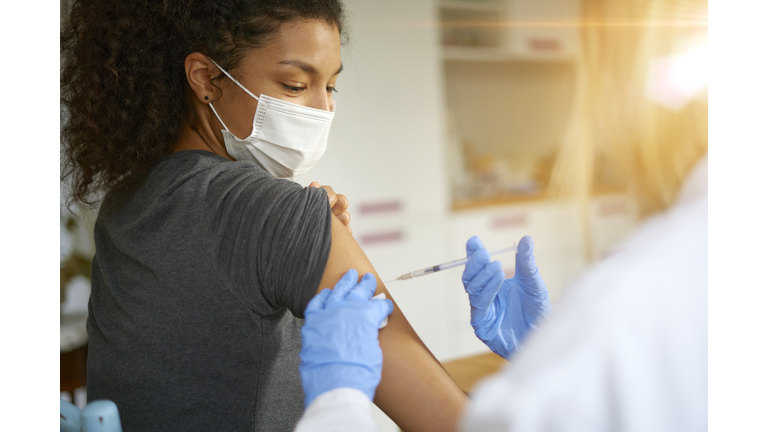 Young woman getting vaccinated