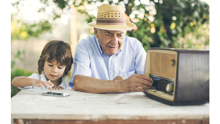 Portrait of a small boy with his grandfather