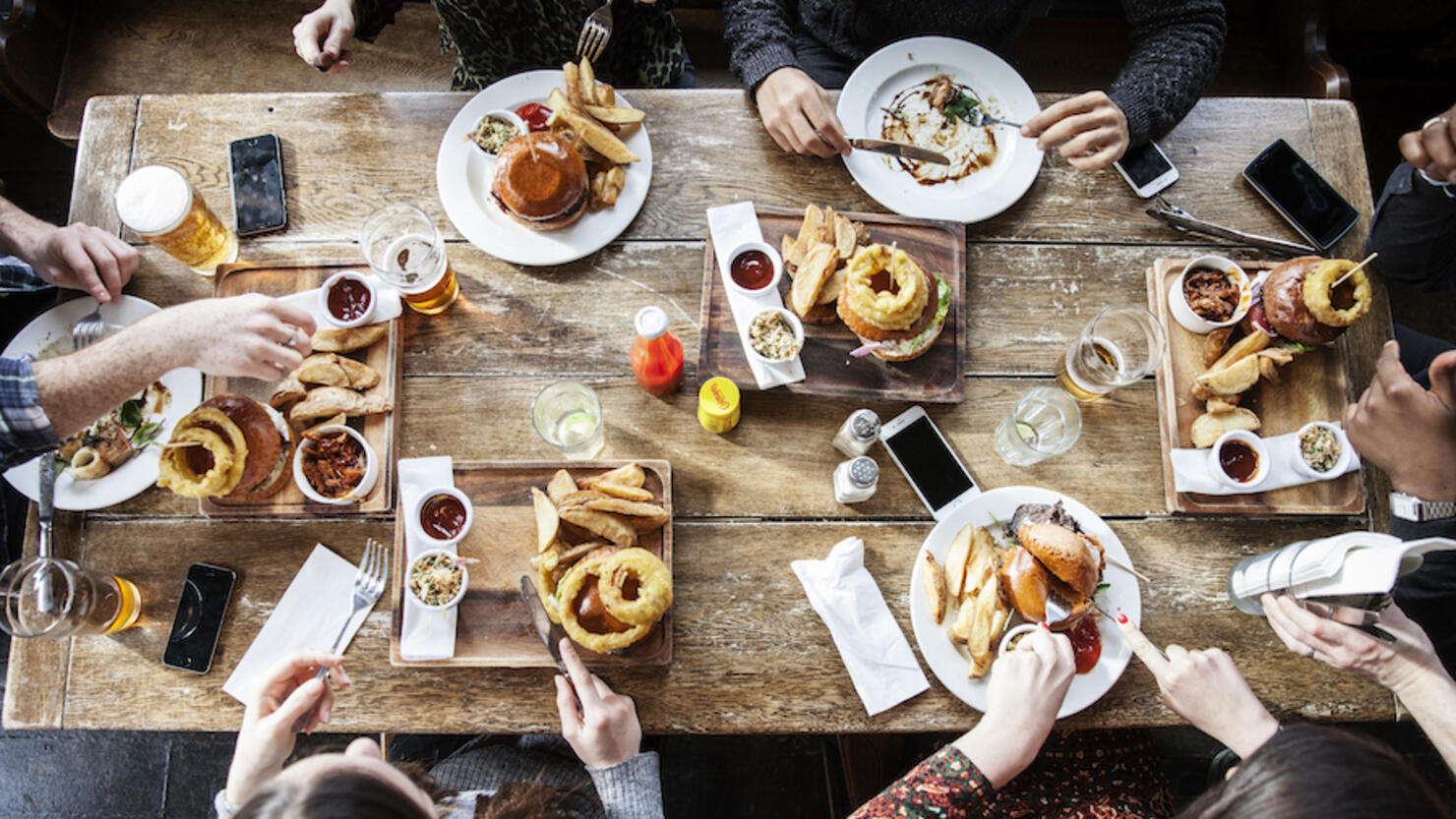 friends at a pub eating, birds view