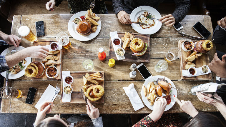 friends at a pub eating, birds view