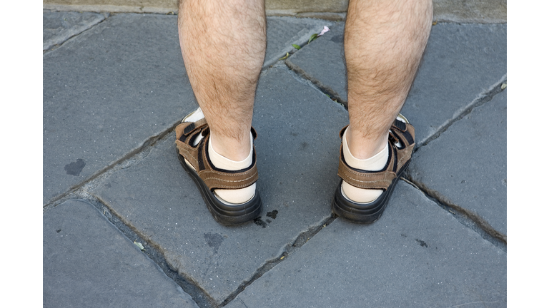 An Englishman abroad: not so stylish legs in the Piazza della Signoria, Florence, Italy