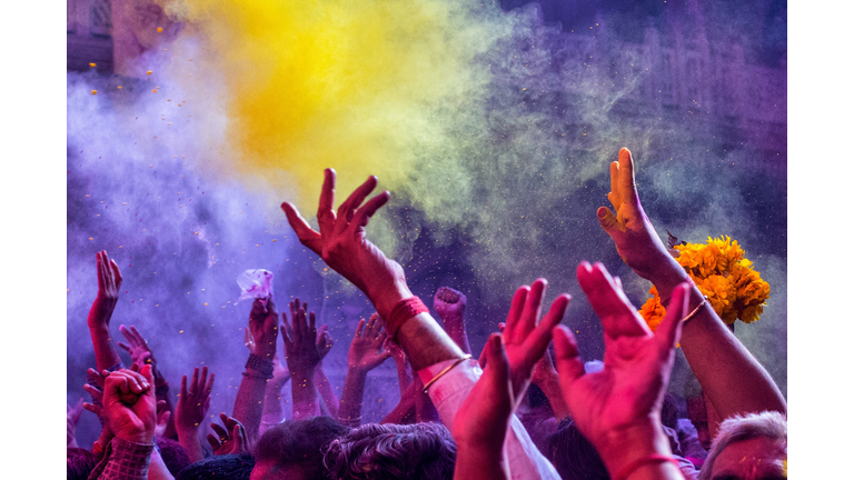 People With Arms Raised During Festival